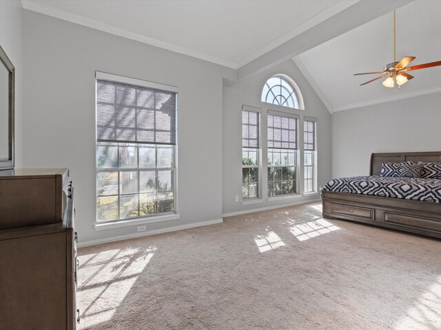 carpeted bedroom with crown molding, ceiling fan, and lofted ceiling