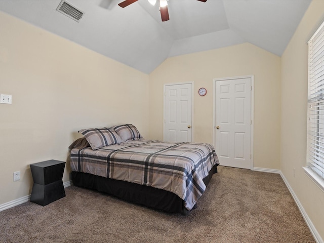 carpeted bedroom featuring ceiling fan and vaulted ceiling