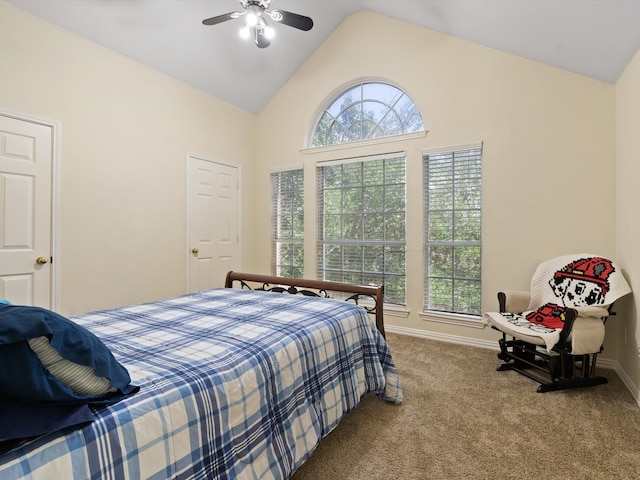 carpeted bedroom featuring ceiling fan and vaulted ceiling