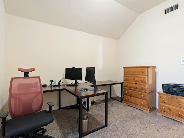 office area with lofted ceiling and light carpet