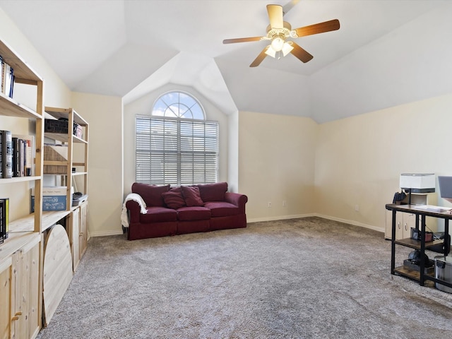 sitting room featuring ceiling fan, light colored carpet, and vaulted ceiling