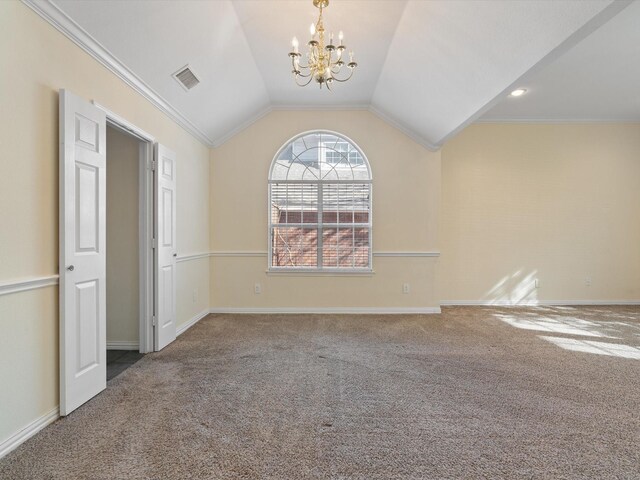 carpeted spare room with lofted ceiling, crown molding, a wealth of natural light, and a chandelier