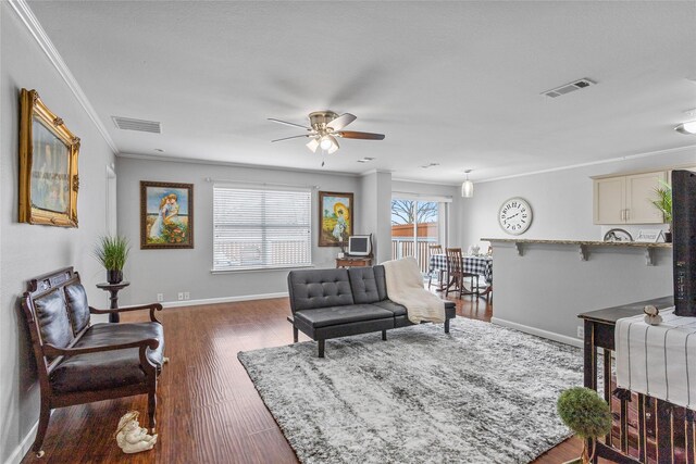 1415 Mallard Dr, Sherman, TX 75092 - living area featuring crown molding, ceiling fan, baseboards, and wood finished floors