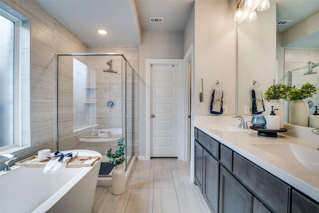 bathroom with vanity and plus walk in shower