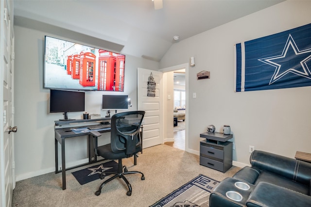 carpeted office with lofted ceiling