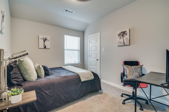 carpeted bedroom with vaulted ceiling