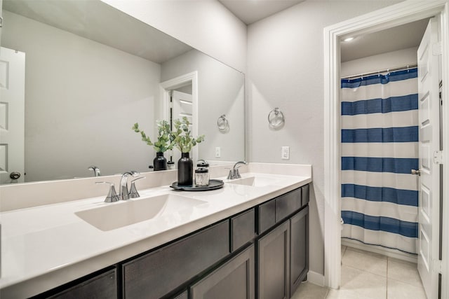 bathroom with tile patterned floors and vanity