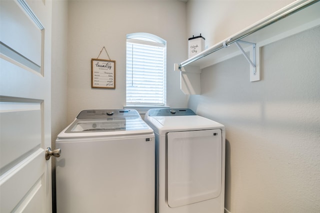 laundry room featuring washer and clothes dryer