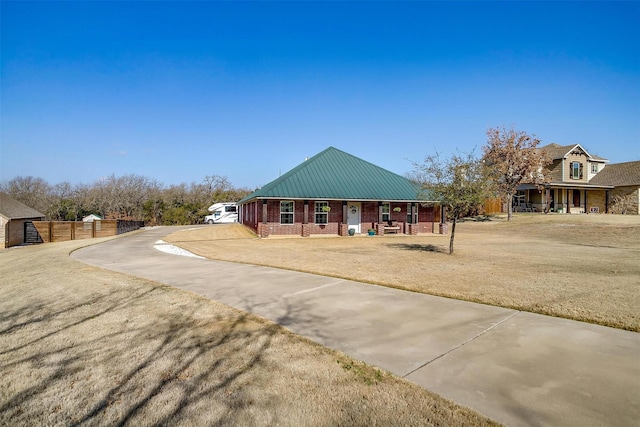 view of front of home with a porch and a front lawn