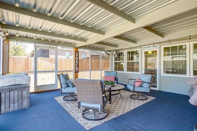 sunroom with beamed ceiling