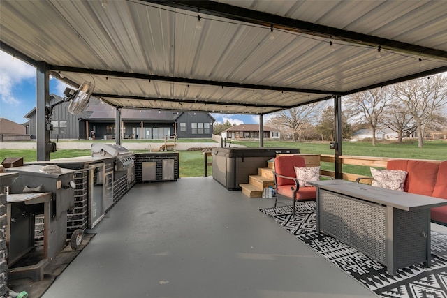 view of patio featuring a grill, an outdoor hangout area, and exterior kitchen