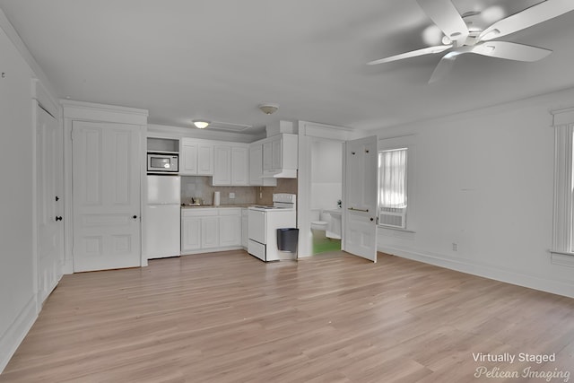 kitchen with white cabinetry, white appliances, decorative backsplash, and light hardwood / wood-style flooring