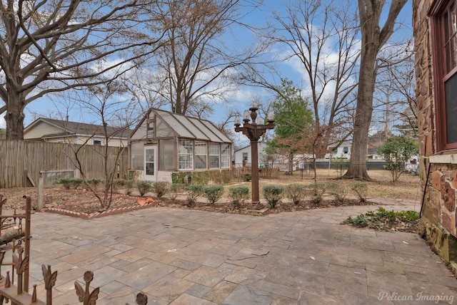 view of patio / terrace with an outbuilding