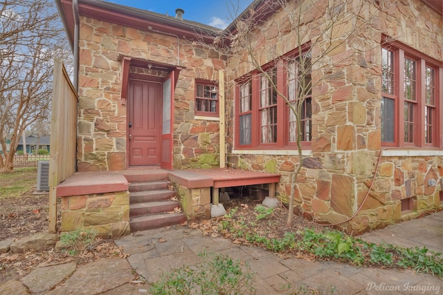 property entrance with central AC unit