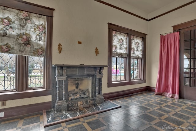 unfurnished living room featuring crown molding