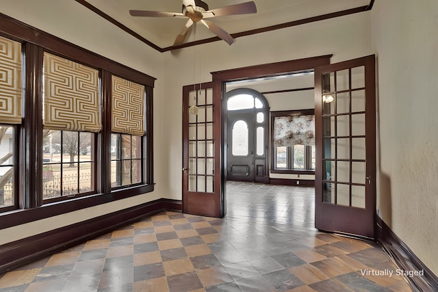 entryway featuring crown molding, ceiling fan, and french doors