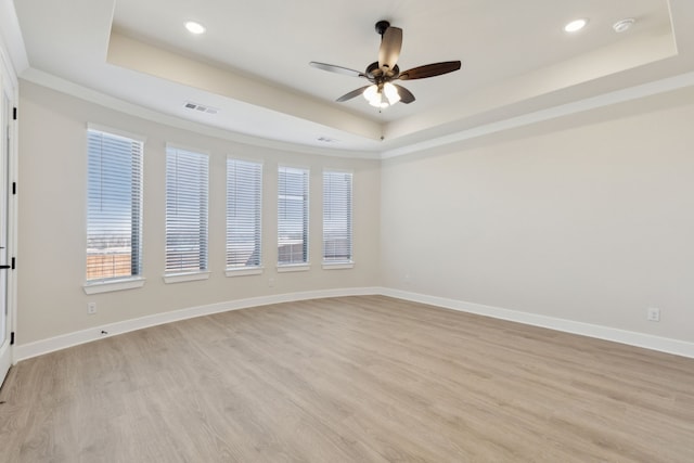 120 Bristol Ln, Azle, TX 76020 - unfurnished room featuring a tray ceiling, ceiling fan, light wood-style floors, recessed lighting, and a smoke detector