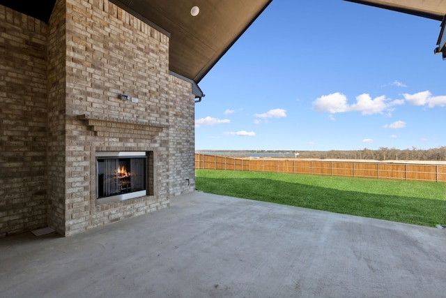 120 Bristol Ln, Azle, TX 76020 - fenced backyard featuring an outdoor brick fireplace and a patio