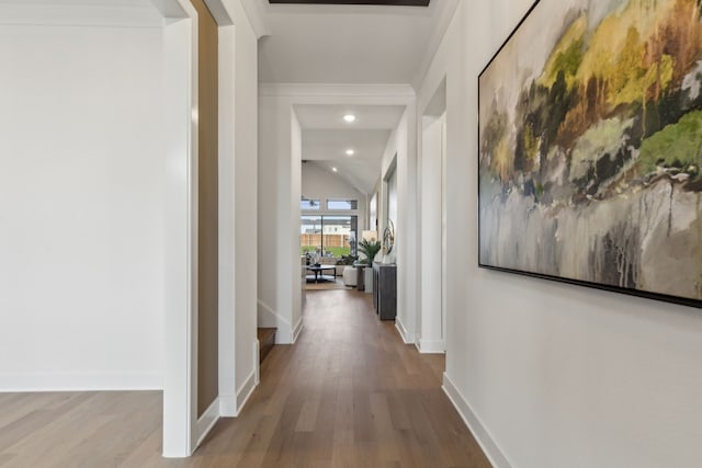 hall with recessed lighting, vaulted ceiling, baseboards, and wood finished floors