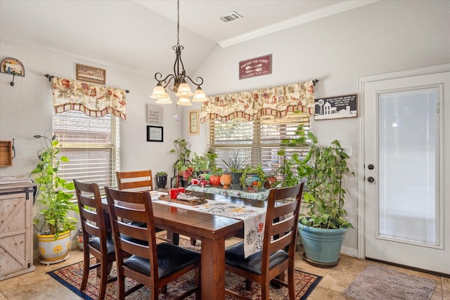 dining space featuring an inviting chandelier and lofted ceiling