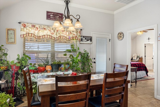 dining area featuring crown molding, ceiling fan with notable chandelier, and light tile patterned flooring