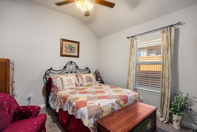 carpeted bedroom featuring lofted ceiling and ceiling fan