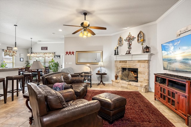 living room featuring light tile patterned flooring, a fireplace, lofted ceiling, ceiling fan, and crown molding