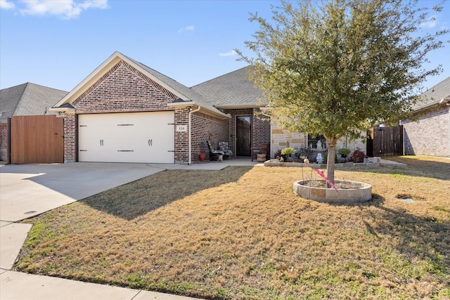 view of front facade with a garage and a front lawn