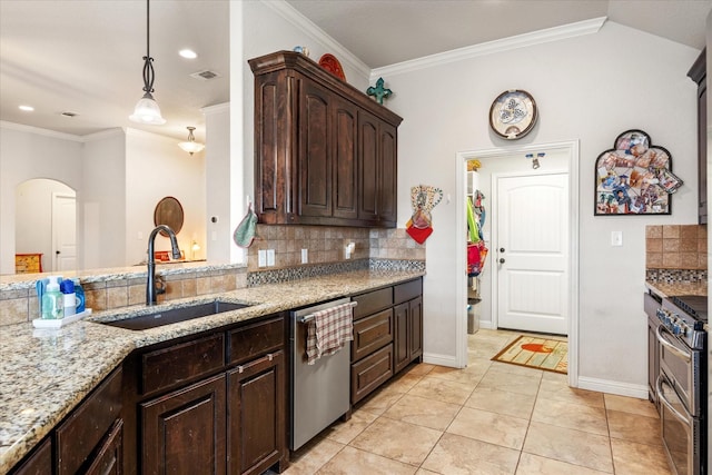 kitchen with pendant lighting, sink, stainless steel appliances, dark brown cabinetry, and light stone countertops