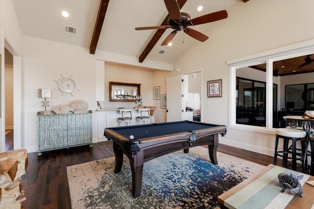 kitchen featuring gray cabinetry, tasteful backsplash, appliances with stainless steel finishes, a towering ceiling, and light stone countertops