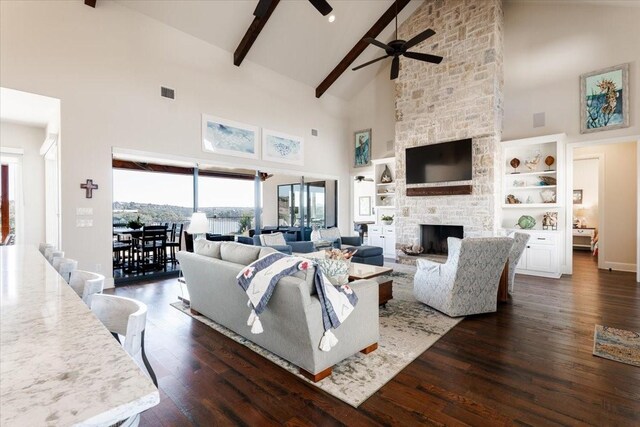 interior space with dark wood-type flooring and vaulted ceiling with beams