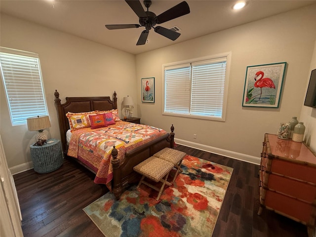 bedroom featuring dark hardwood / wood-style flooring and ceiling fan