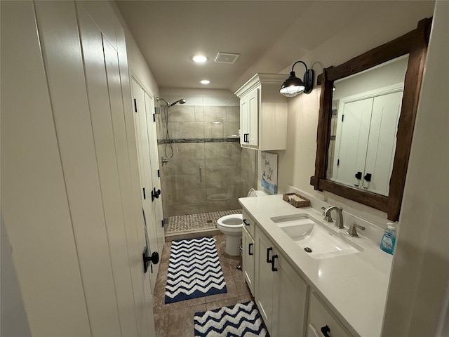 bathroom featuring tile patterned flooring, toilet, vanity, and walk in shower