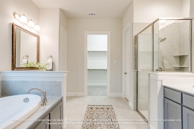 bathroom featuring vanity, tile patterned floors, and independent shower and bath