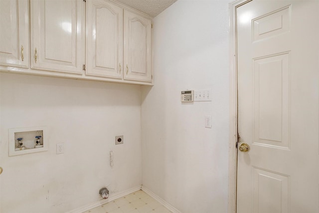 laundry room featuring electric dryer hookup, washer hookup, and cabinets