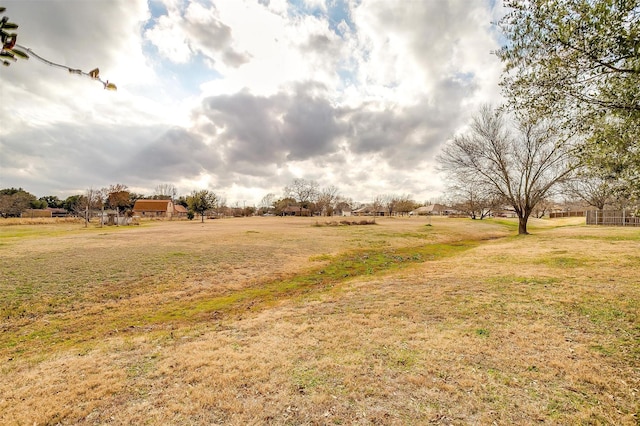 view of yard with a rural view