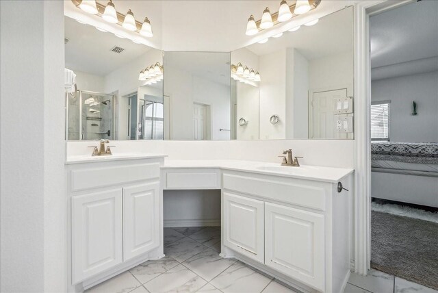 bathroom with vanity, a healthy amount of sunlight, and walk in shower