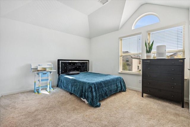 carpeted bedroom featuring multiple windows and vaulted ceiling