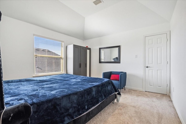 bedroom with vaulted ceiling and carpet