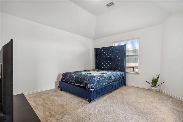 bedroom featuring carpet flooring and vaulted ceiling