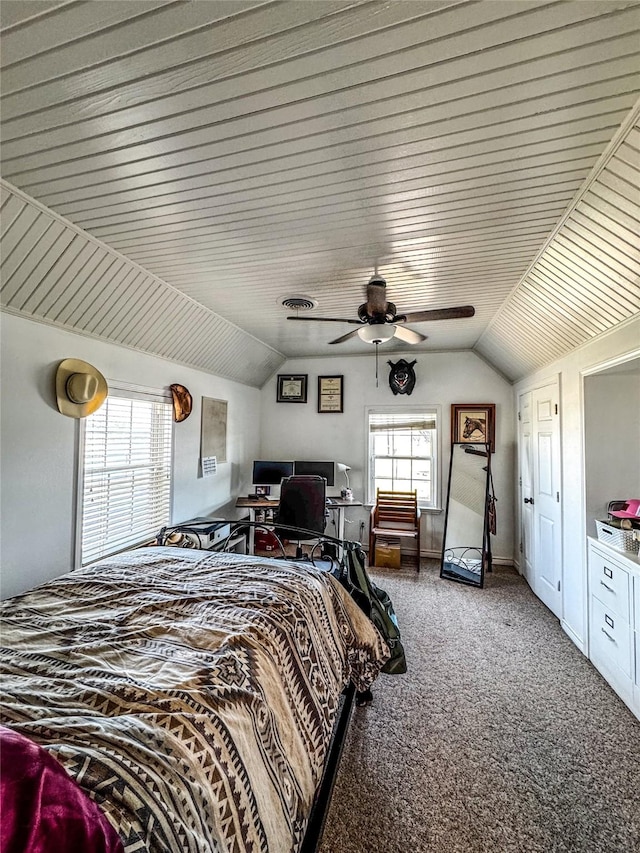 carpeted bedroom with lofted ceiling and ceiling fan