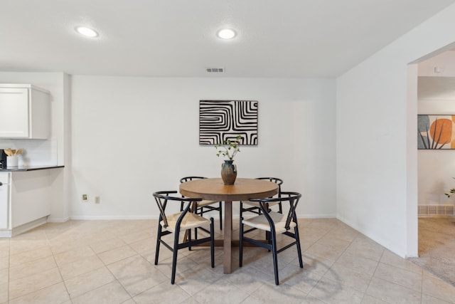 dining area featuring light tile patterned floors