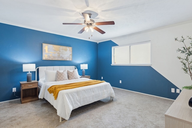 bedroom with ornamental molding, carpet, baseboards, and a ceiling fan