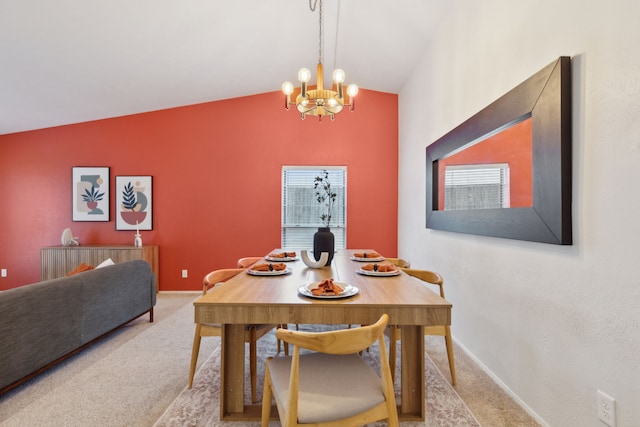 carpeted dining area with vaulted ceiling and a chandelier