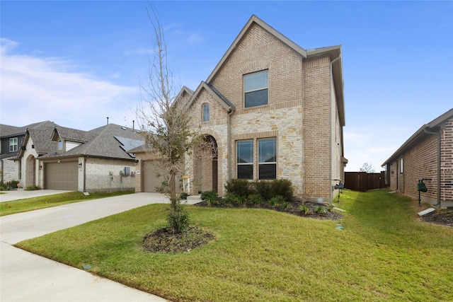 view of front facade with a garage and a front yard