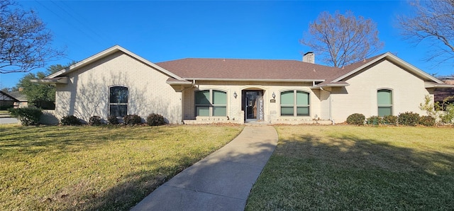 ranch-style house with a front lawn