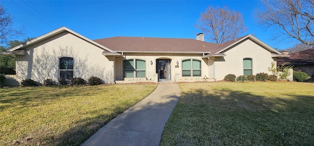 ranch-style home featuring a front yard