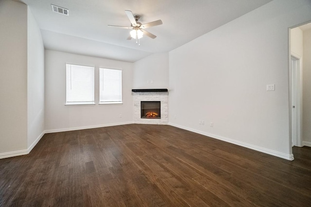 3244 Cross Shore Dr, Anna, TX 75409 - unfurnished living room featuring visible vents, dark wood-type flooring, a fireplace, baseboards, and ceiling fan