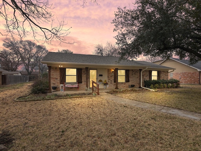 ranch-style house with a lawn