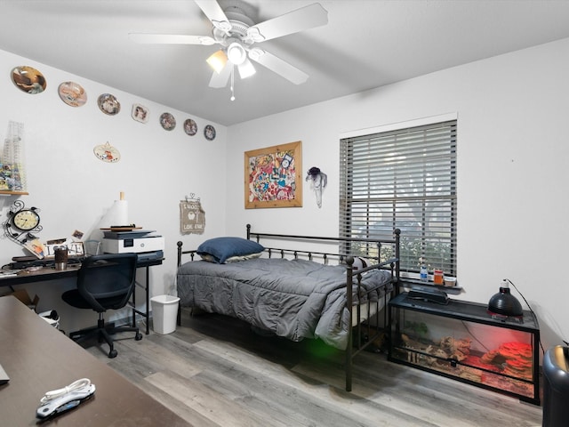 bedroom with ceiling fan and light hardwood / wood-style flooring